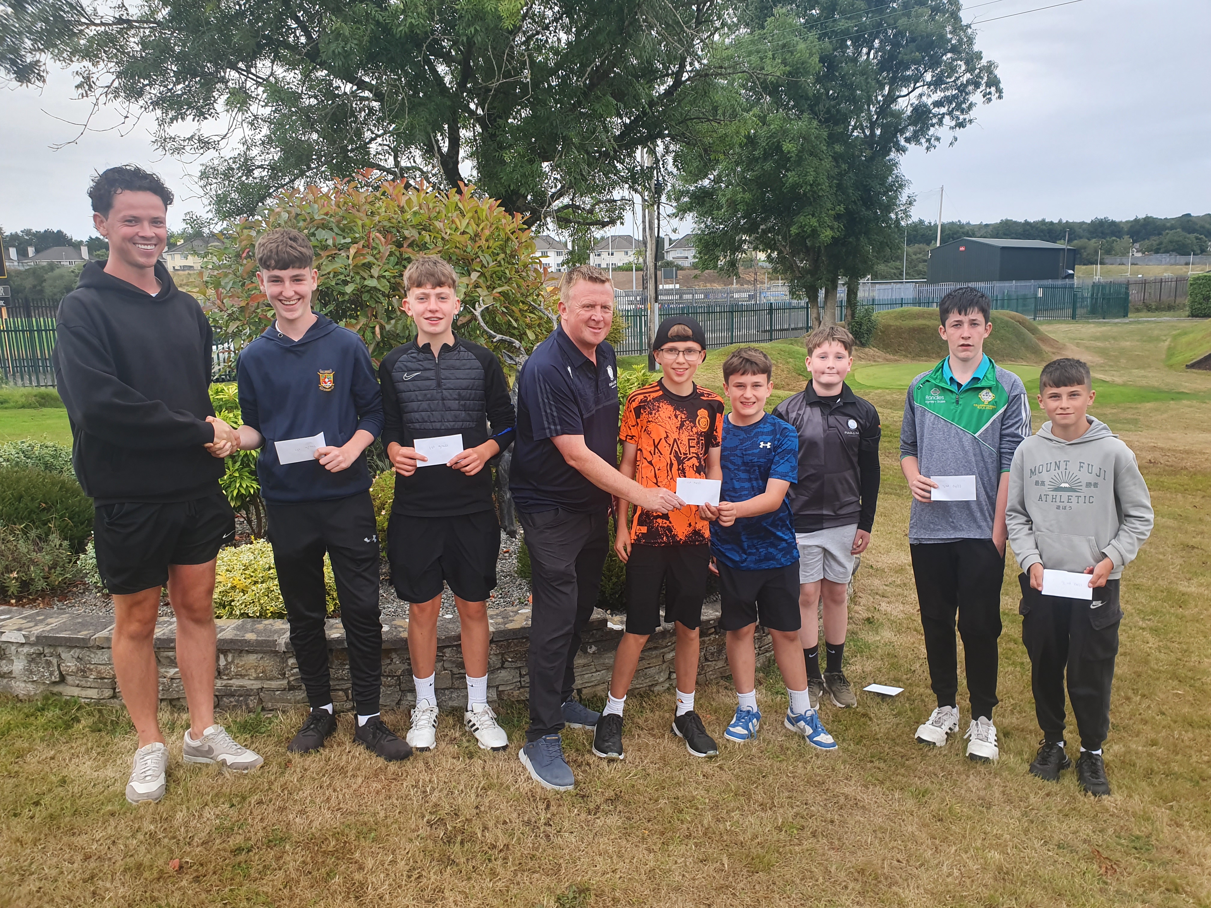 Deerpark Pitch & Putt U16 Officers Michael Cronin (left) and Niall O'Loughlin (centre) presenting the prizes from the U16 section of the Ricky Kelly Memorial event to L to R: Fionn McMonagle, Daniel Quinlan, Ryan Lowe,  Adam O'Sullivan, Stevie Murphy, Adam Twomey and Lucas Uchtyil.