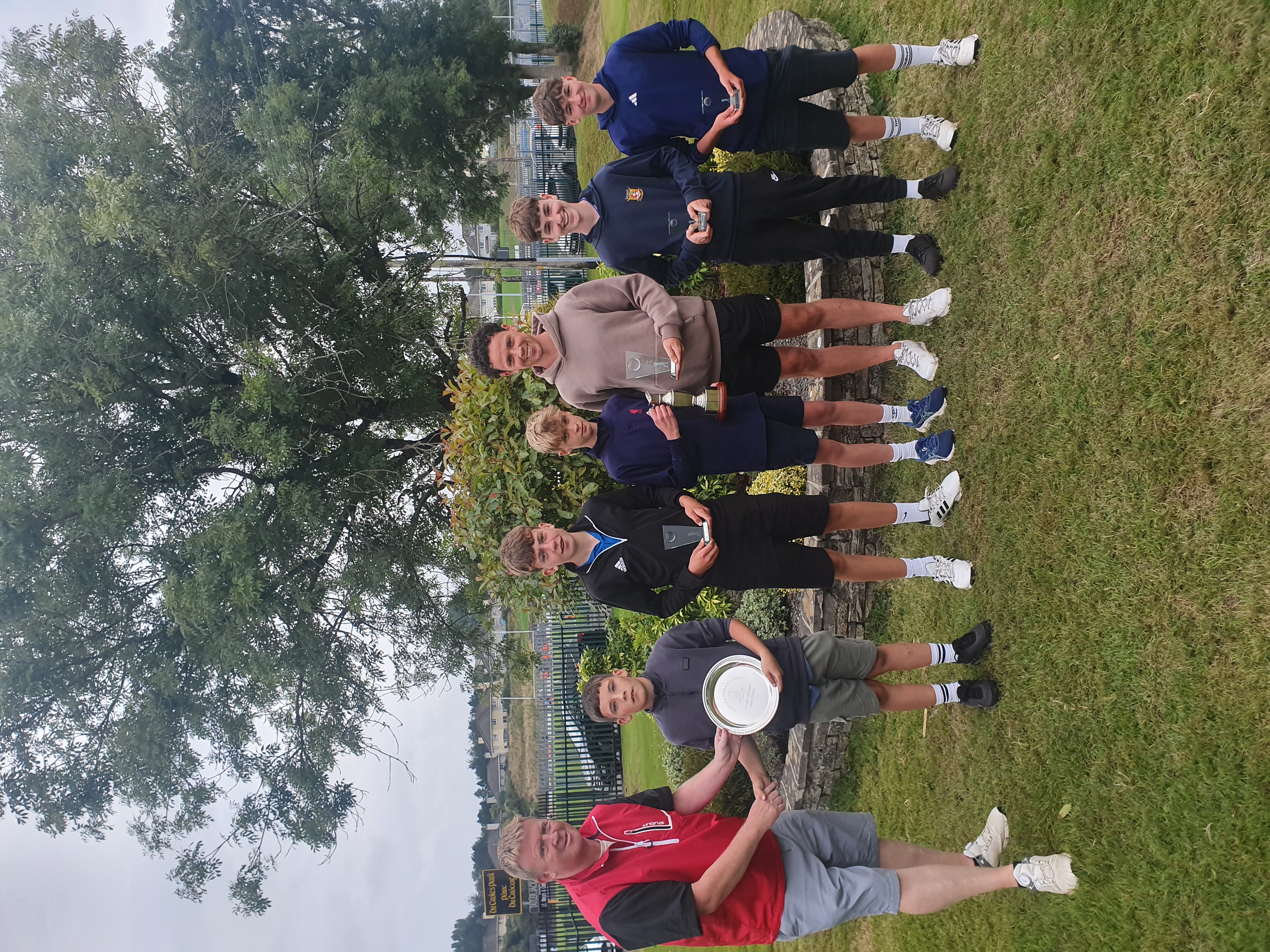 Deepark Pitch & Putt Club U16 Officers Michael Cronin (third from right) and Niall O'Loughlin (left) presenting the prizes from the Trophyworld Tralee sponsored U16 Club Matchplay event which took place on Tuesday August 25th last. Pictured L to R: Dylan Moynihan (Plate Winner), Daniel Quinlan (Championship Runner-Up), Fionn Culloty (Championship Winner), Fionn McMonagle and Ben O'Sullivan (Championship Semi-Finalists). Missing from photo Ryan O'Donoghue (Plate Runner-Up).
